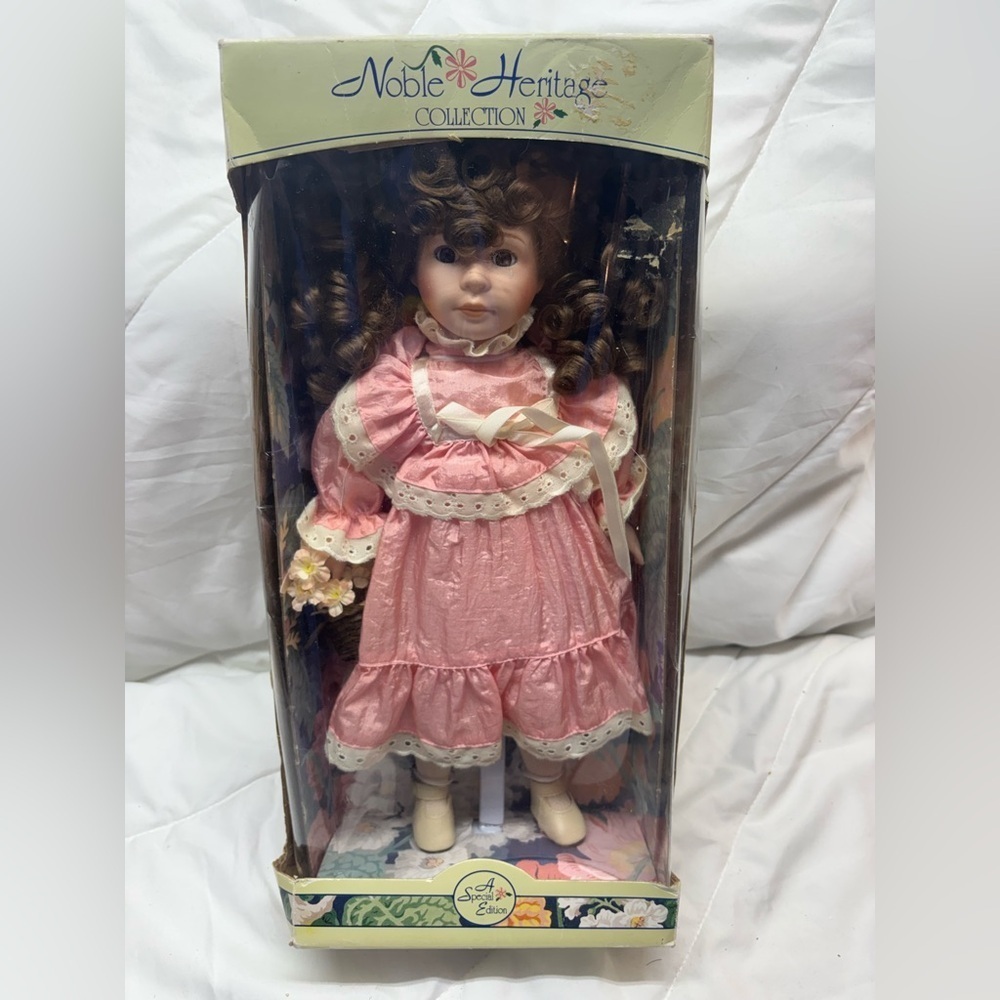 Noble Heritage Collection Porcelain Doll with Curly Brown Hair & pink dress